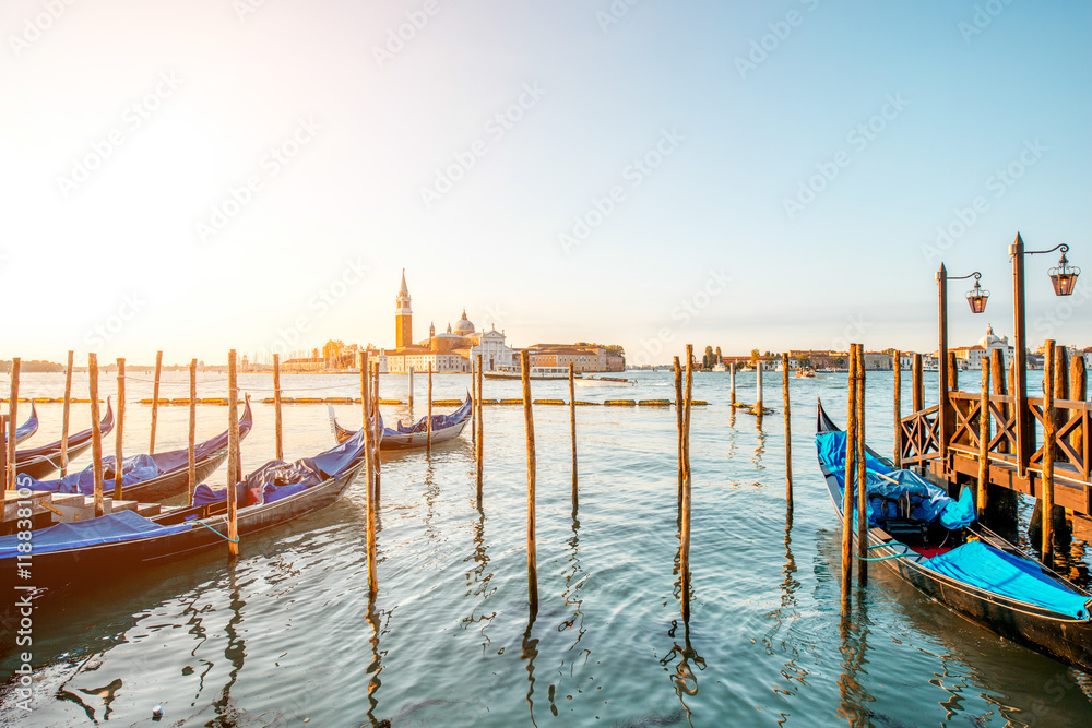 Venice landscape view on San Giorgio Maggiore island with gondolas on the foreground