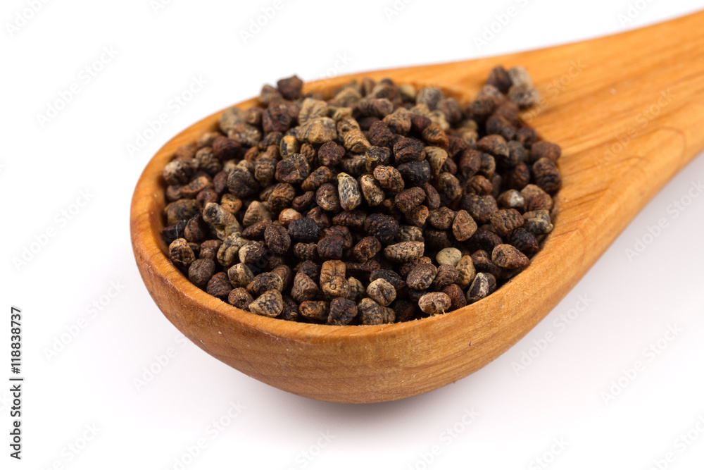 Decorticated cardamom seeds in a wooden spoon Decorticated cardamom seeds in a wooden spoon