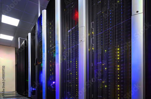 Data center full of server cabinets and racks