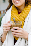 Relaxed woman drinking hot coffee outside on autumn. Tranquility at home concept.