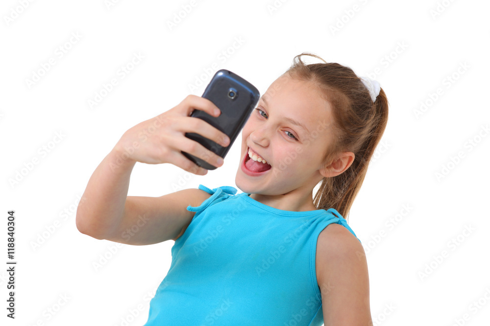 preteen girl with mobile phone taking a self-portrait preteen girl with mobile phone taking a self-portrait