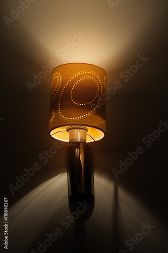 Fotografi included wall lamp in the bedroom at the evening