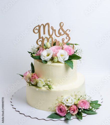two  layered wedding cream cheese cake with roses and eustoma
