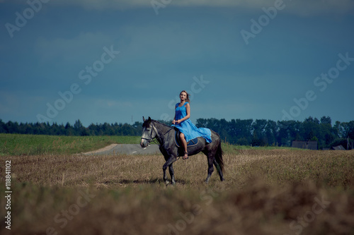Horseback riding in the hunting grounds in linen clothes from fashion designers. © alexeyvronsky