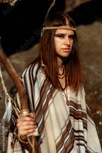 beautiful boho woman with warrior shaman make up photo