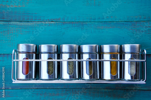 Fototapeta Naklejka Na Ścianę i Meble -  Spice rack on a wooden wall