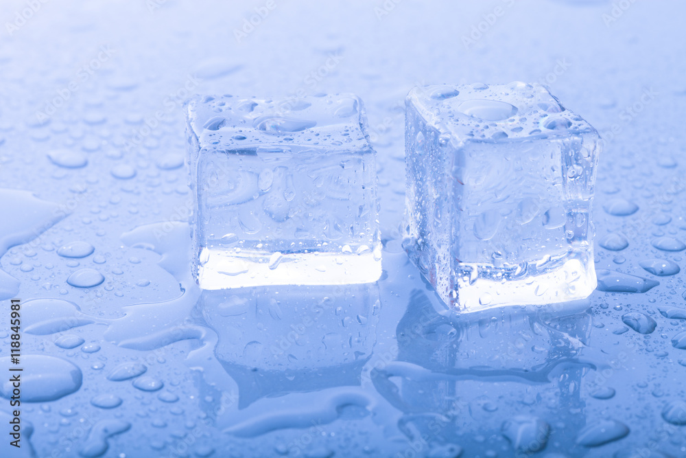 Ice cubes on a wet table. Selective focus. Toned Ice cubes on a wet table. Selective focus. Toned