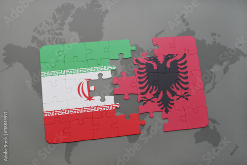 puzzle with the national flag of iran and albania on a world map background.