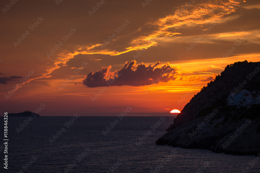 View of a beautiful sunset and orange sky in Dubrovnik, Croatia. Copy space.