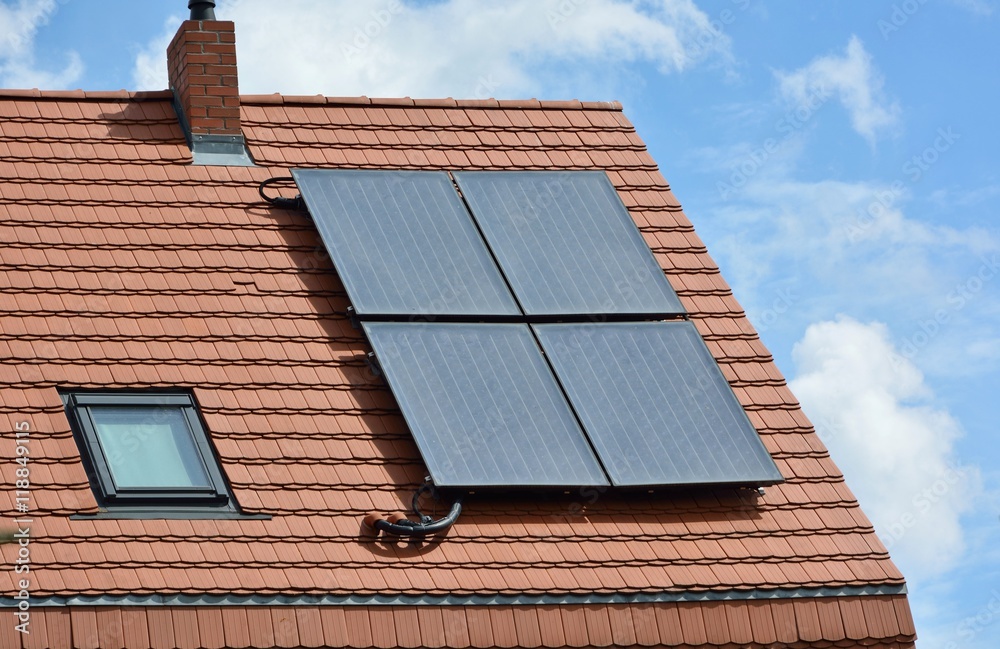 Fototapeta premium Solar energy panels on roof of house