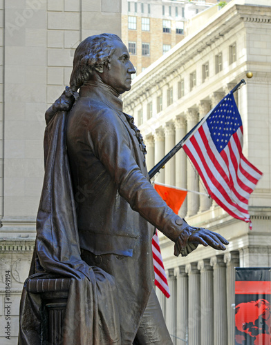 George Washington statue with American flag at Federal Hall in New York City, birthplace of American Government and location of first Congress and Supreme Court