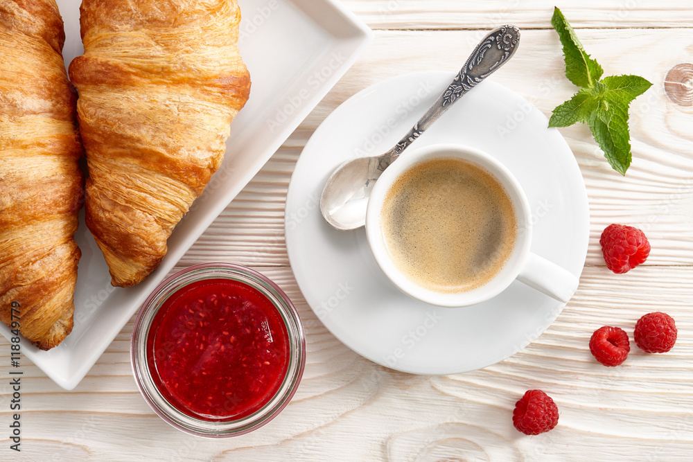 Morning breakfast with espresso coffee, raspberry jam and fresh croissants. Morning breakfast with espresso coffee, raspberry jam and fresh croissants.