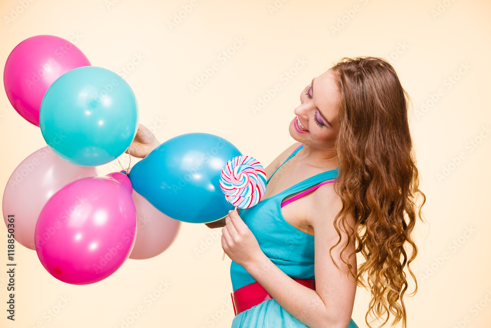Woman with colorful balloons and lollipop Woman with colorful balloons and lollipop