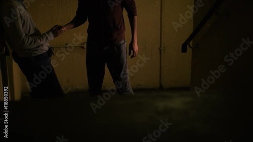  Drug dealing in a rundown stairwell, in slow motion
