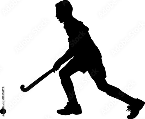 Silhouette of boy hockey player running with ball