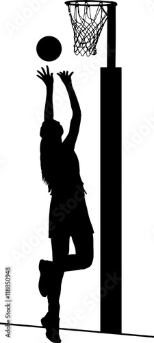 Silhouette of girls ladies netball player shooting for goal