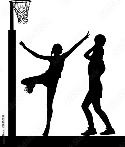 Silhouette of girls ladies netball players jumping and blocking