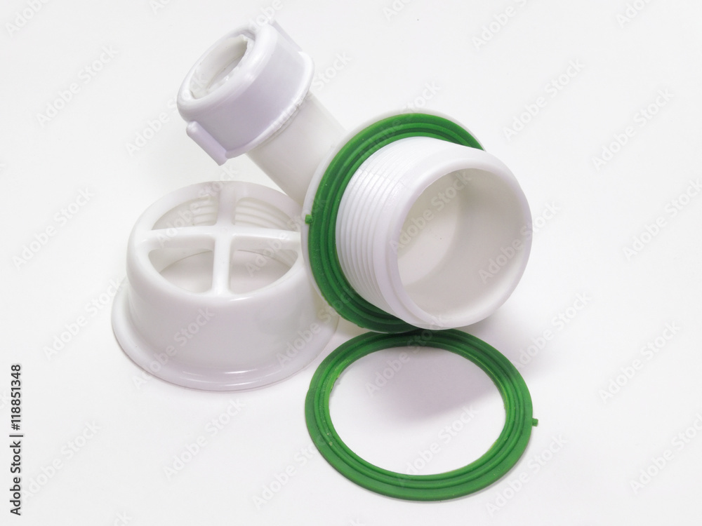 Plastic grid for drain for hole of the sink. A fragment of the d Plastic grid for drain for hole of the sink. A fragment of the d