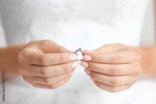 Bride holding wedding ring