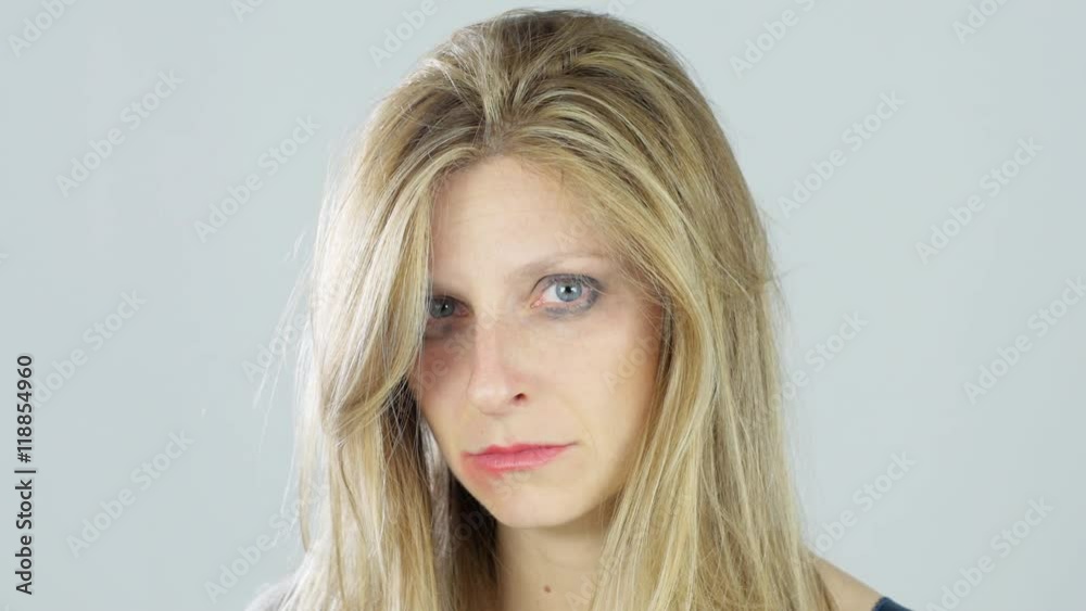sad despaired woman victim of a violence looking into the camera sad despaired woman victim of a violence looking into the camera