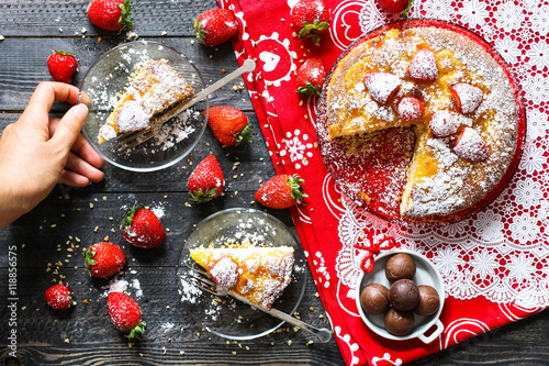 Fototapeta Naklejka Na Ścianę i Meble -  Lemon cake with strawberries, sugar end chocolate