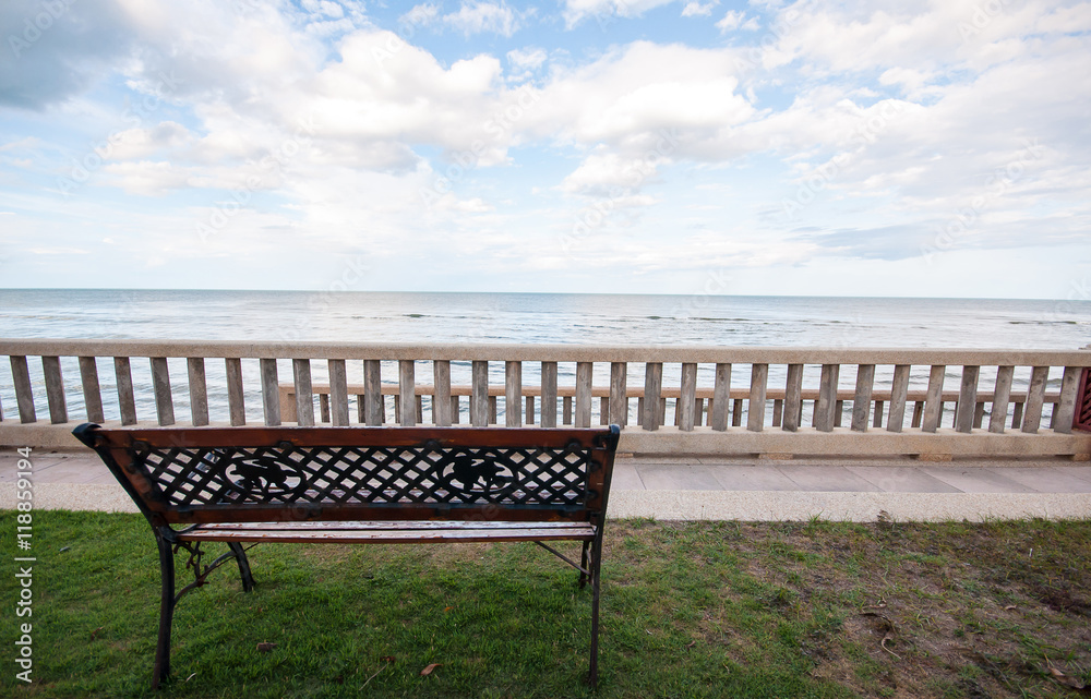 Wooden bench with the look at blue sea and sky