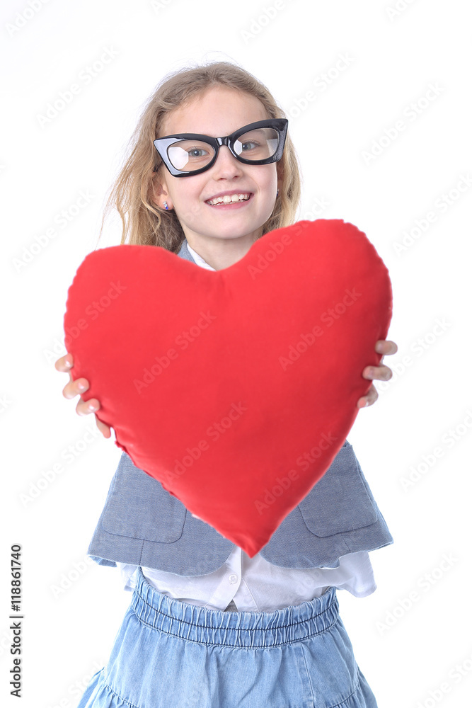 Delightfully smiling young girl with a heart Delightfully smiling young girl with a heart