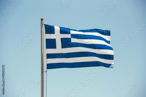 Greek flag on the blue sky background