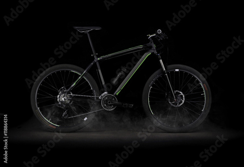 Bicycle on black background with smoke
