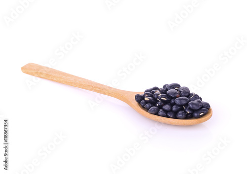 Black eyed peas beans in wooden spoon isolated on white