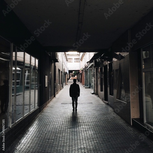 a lone man on an city street. lonely concept