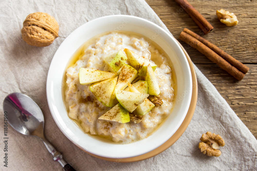 oatmeal porridge with apples, honey, nuts and cinnamon oatmeal porridge with apples, honey, nuts and cinnamon