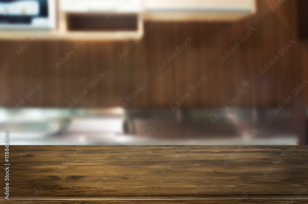 Dining table on blurred brown kitchen interior background Dining table on blurred brown kitchen interior background