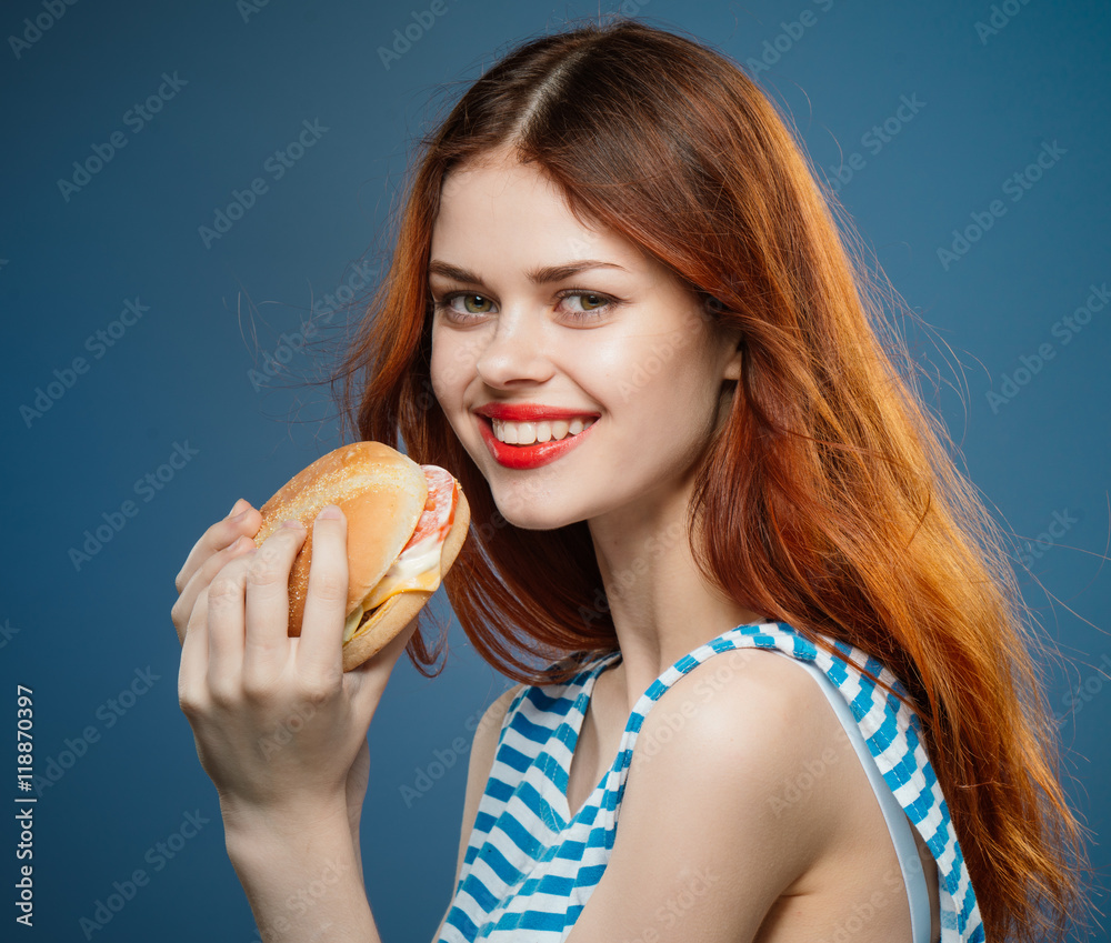 woman holding a burger