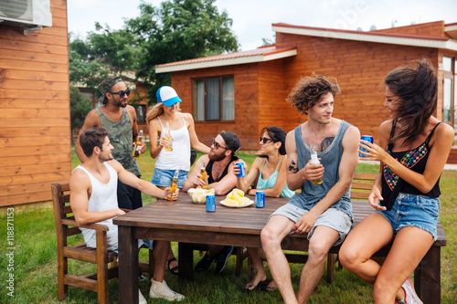 Photography Happy young people drinking beer and having outdoor summer party