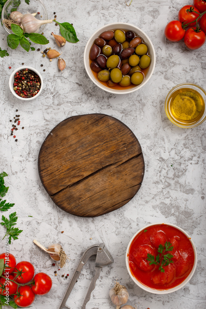 Italian food cooking ingredients with wooden blank board