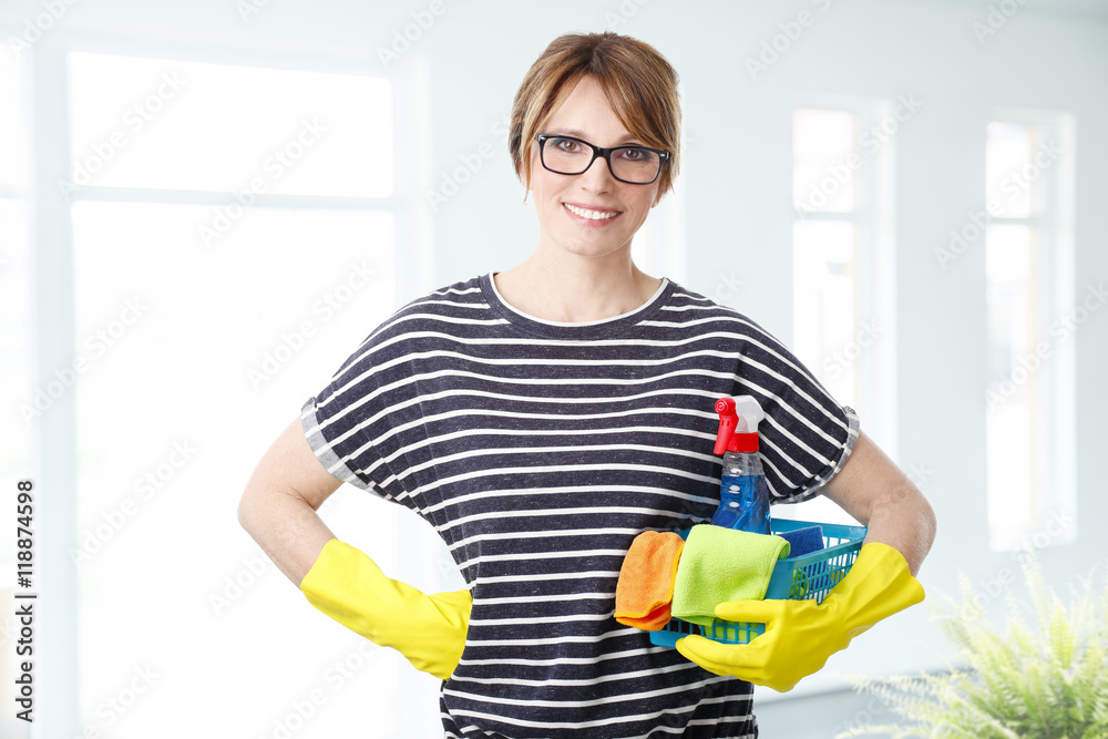 Housekeeper woman is starting to clean the house Housekeeper woman is starting to clean the house
