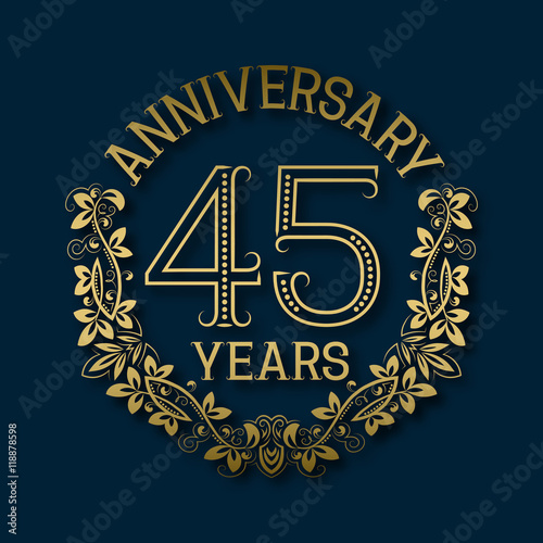 Golden emblem of forty fifth years anniversary. Celebration patterned logotype with shadow on blue.