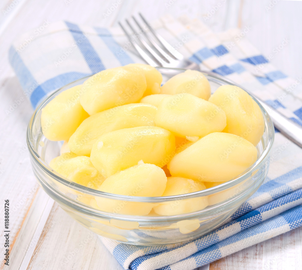boiled potatoes in bowl on wooden ruched boiled potatoes in bowl on wooden ruched