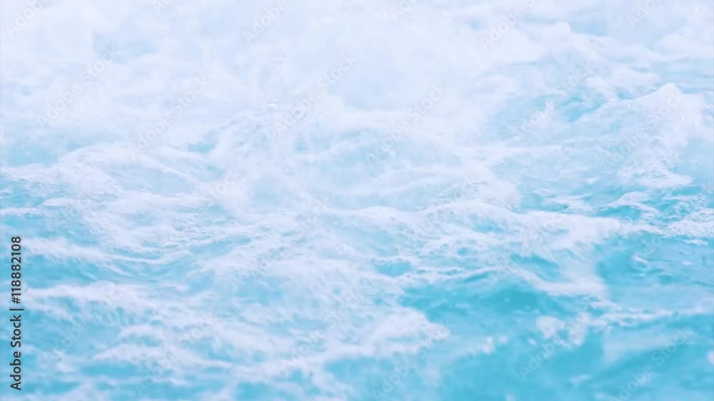 Flowing water in wellness and Spa swimming pool at aquapark. Close up footage. 