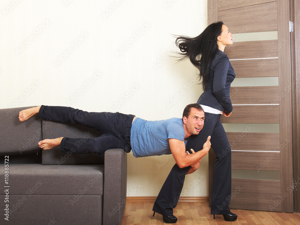 Man desperately clinging to the leg of a woman Stock Photo Adobe Stock