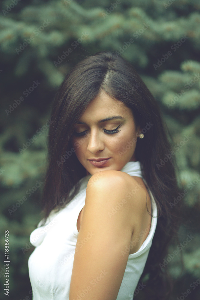 Portrait of beautiful young woman in nature