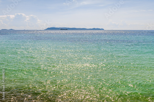 Blue sea water with sunlight and blue sky