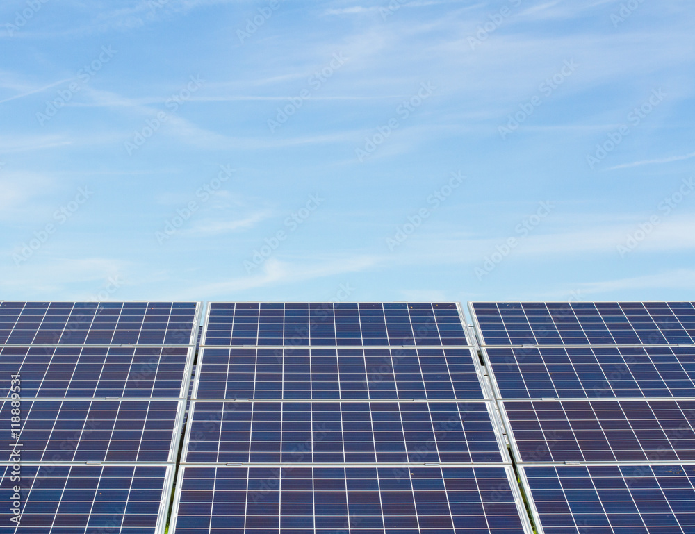 A solar panel generating electricity under a blue sky for copy space. A solar panel generating electricity under a blue sky for copy space.