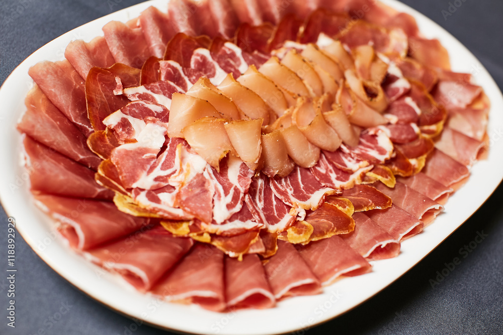 Assortment of delicatessen cold meat, salami, ham and bacon Assortment of delicatessen cold meat, salami, ham and bacon