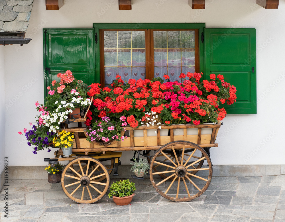 Decorative wooden cart filled with flowers