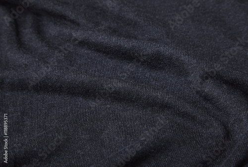 A full page of black fine knit fabric texture