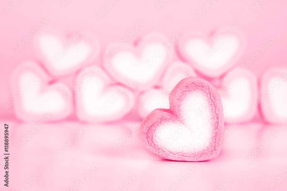 marshmallow heart shape in cup on pink background marshmallow heart shape in cup on pink background