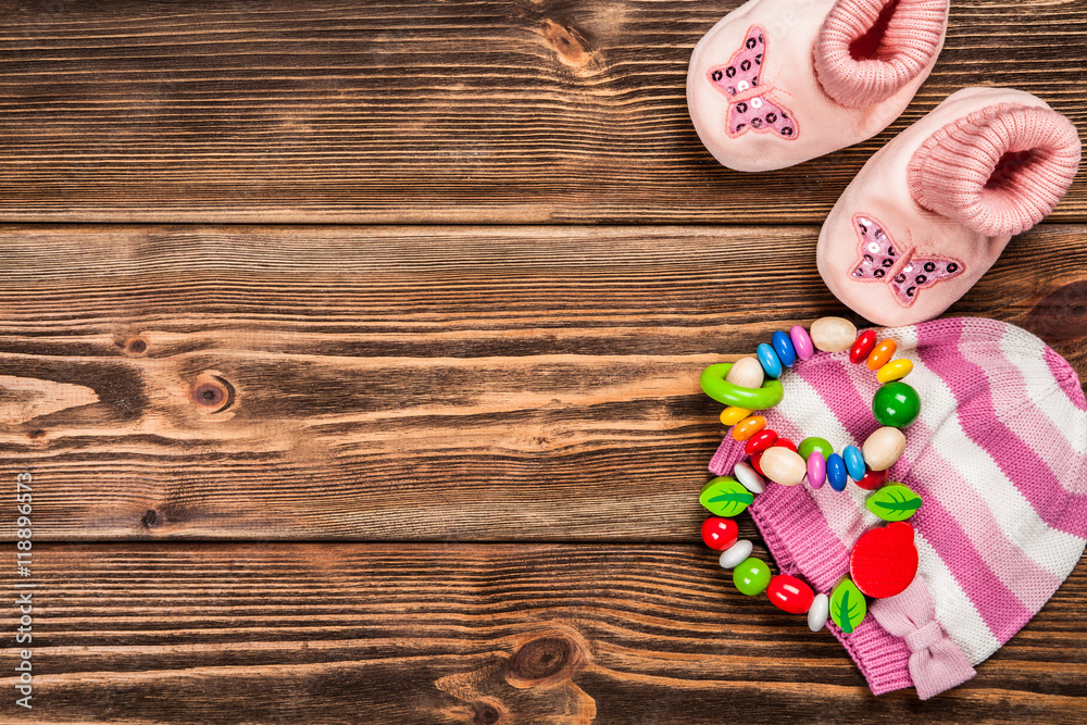 Baby clothes on wooden background