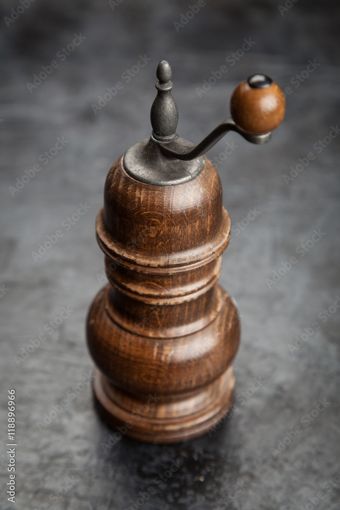 Pepper grinder on dark background Pepper grinder on dark background